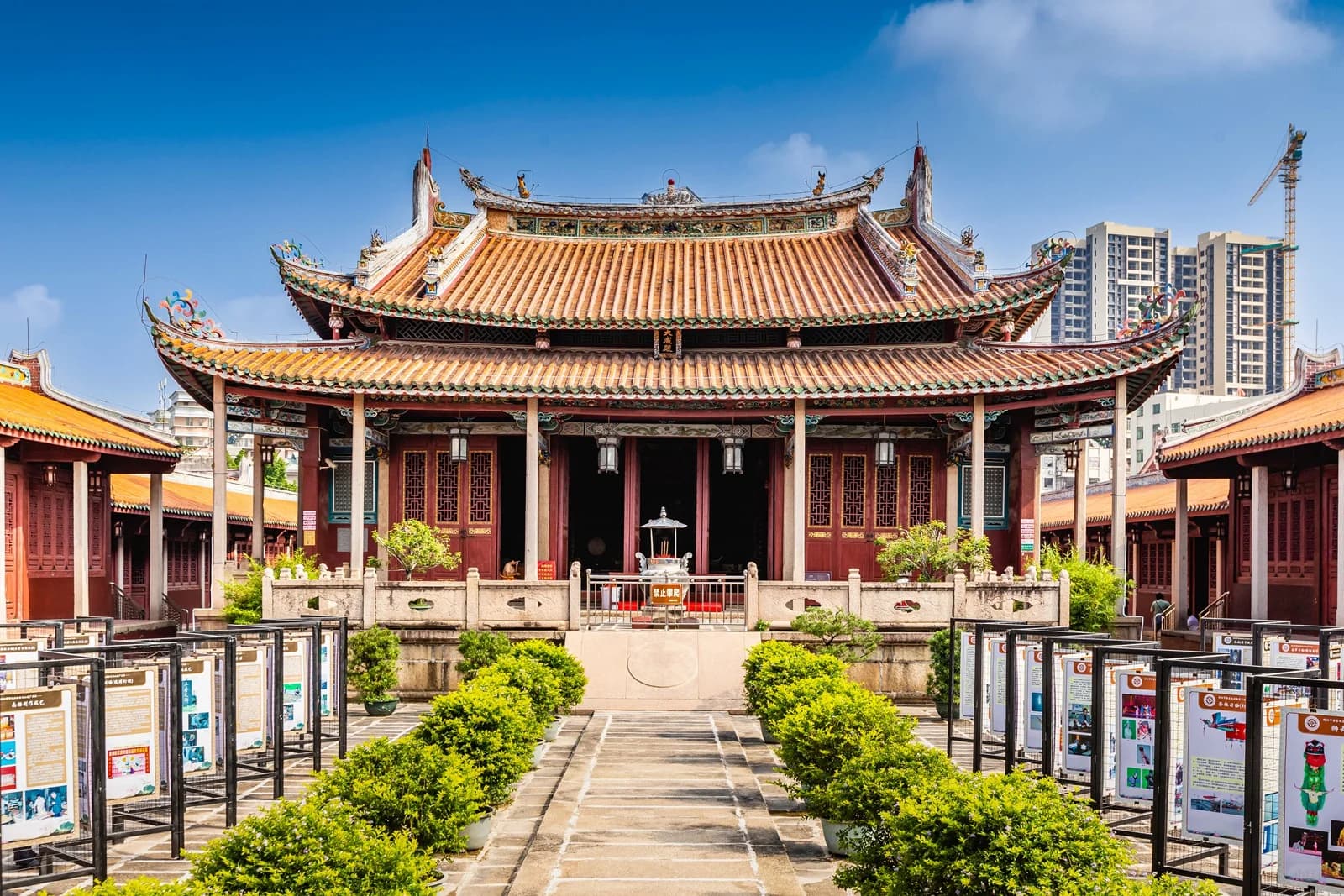 The main hall and symmetrical courtyard at Jieyang Academy under a blue sky