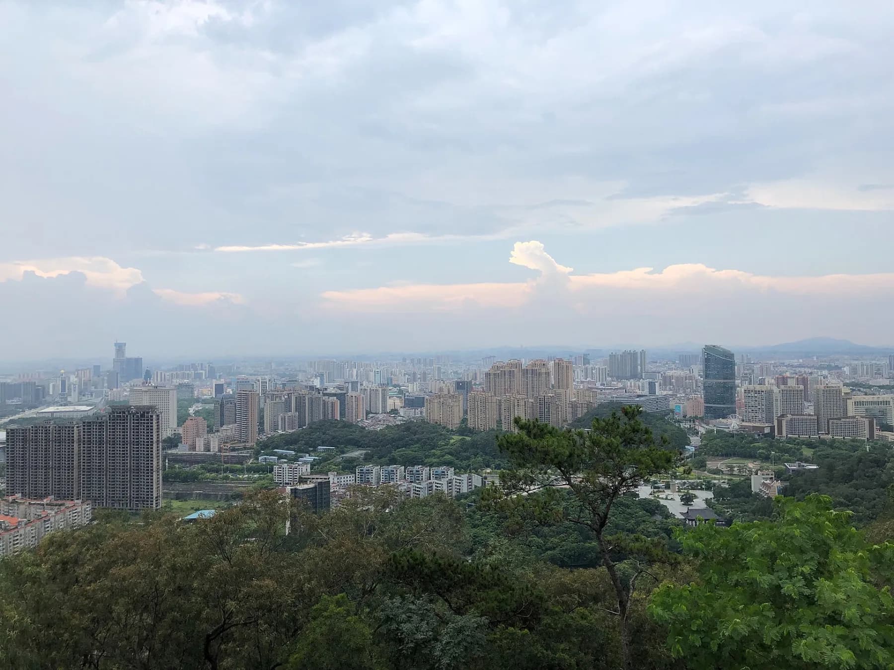Central Dongguan skyline and dense neighbourhoods seen from Huangqi Mountain