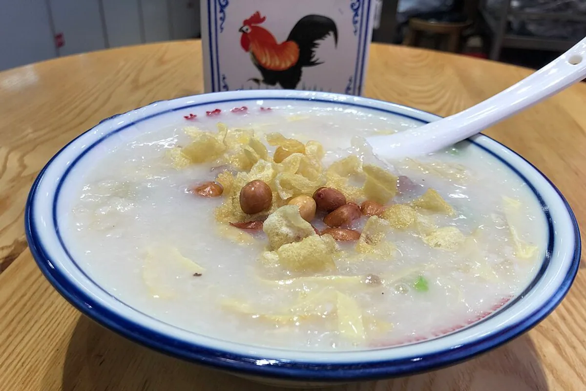 A bowl of Cantonese congee with savoury toppings