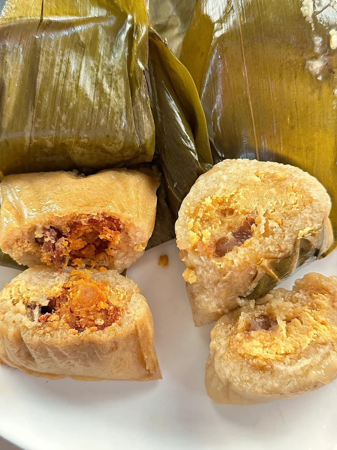 Daojiao zongzi cut open to show the glutinous rice and savoury filling