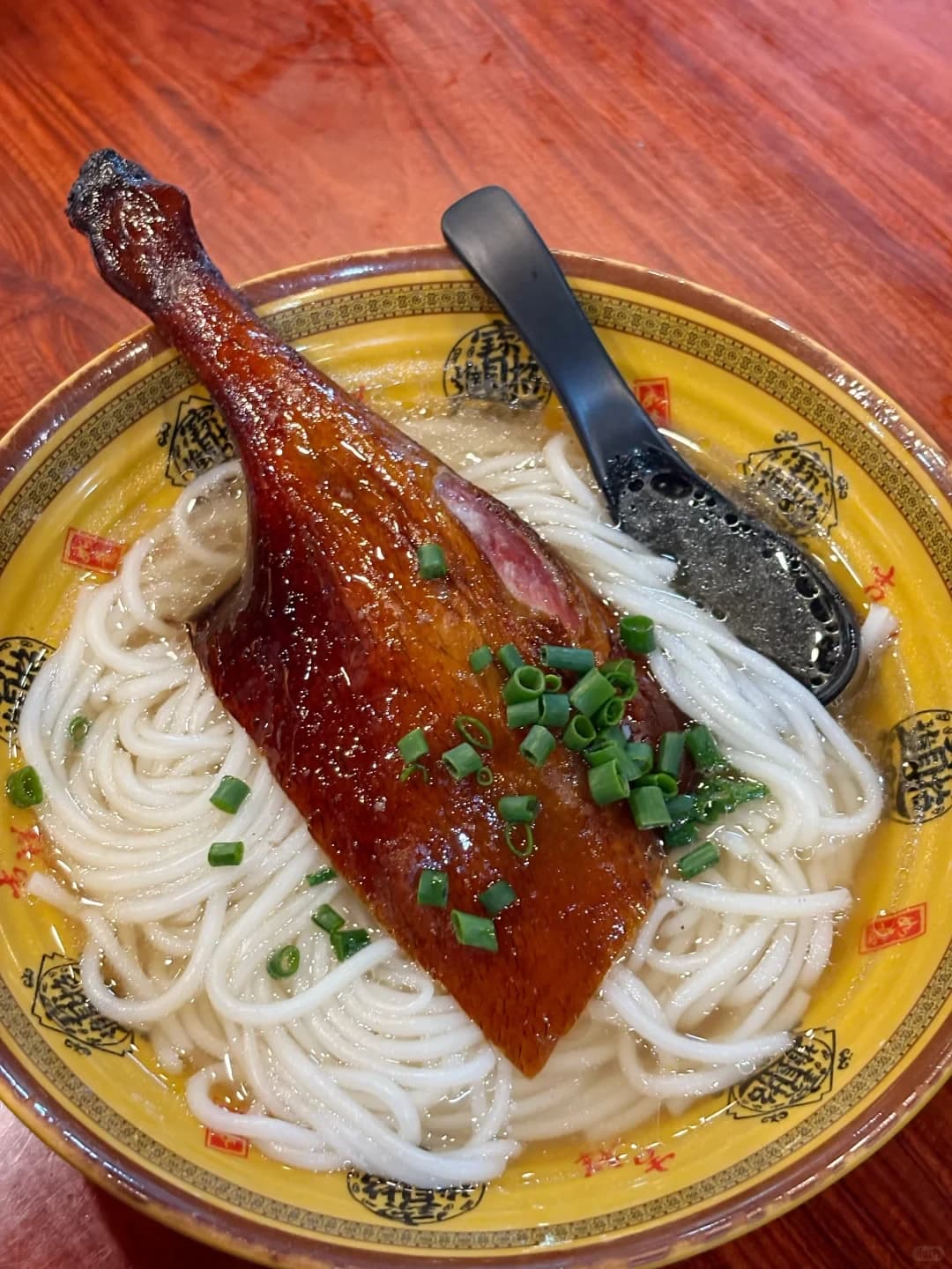 Houjie lai fun rice noodles topped with roast goose