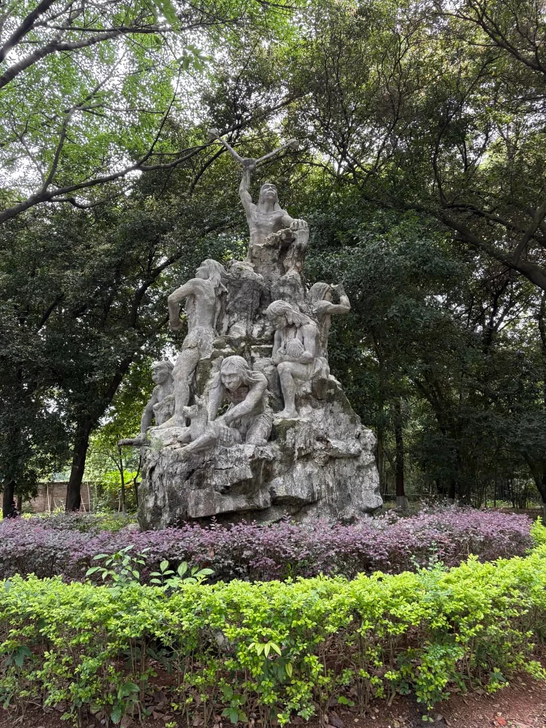 A sculpture among trees in the Maba Man site park