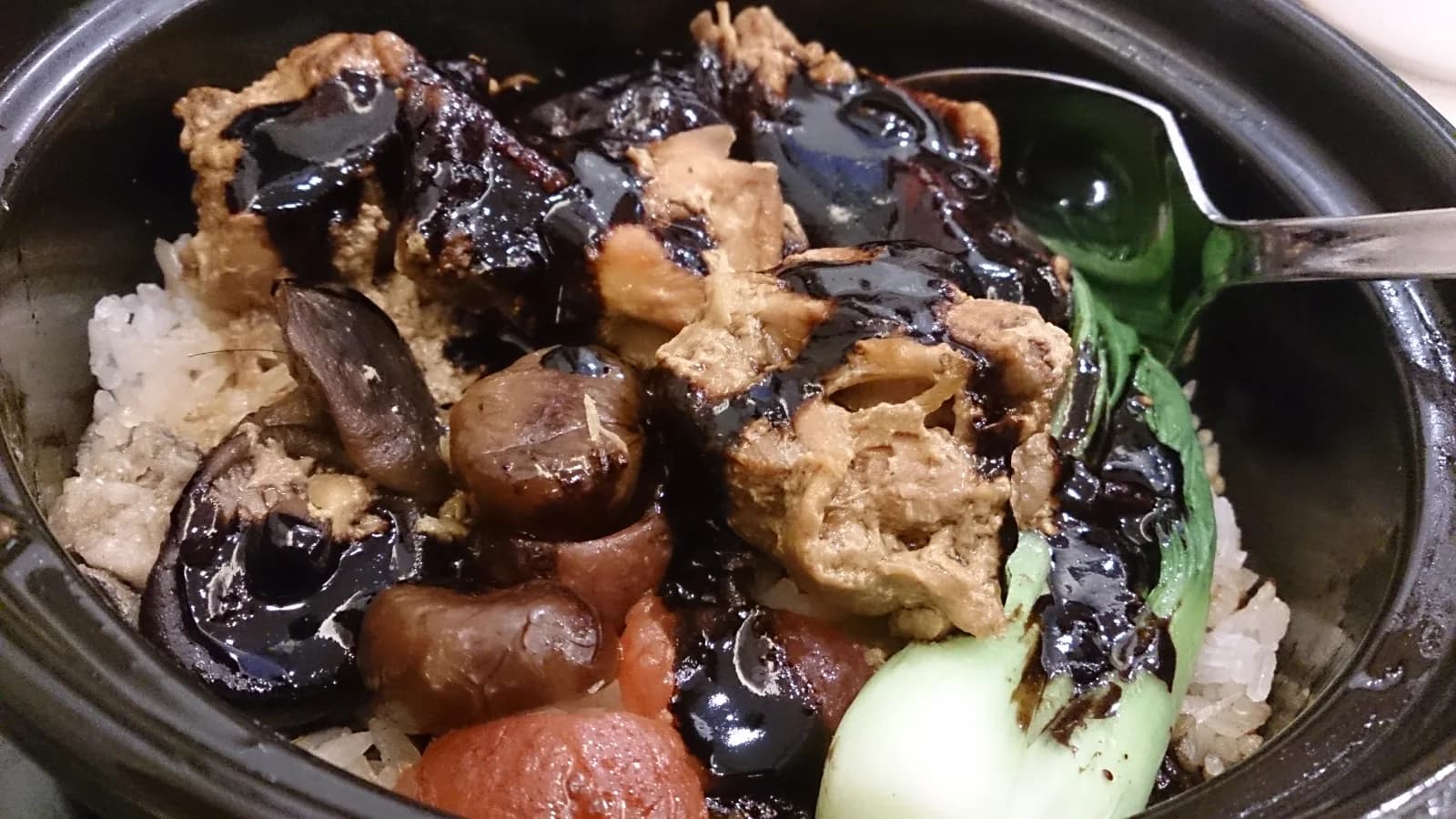 Rice, Chinese sausage and vegetables served in a clay pot