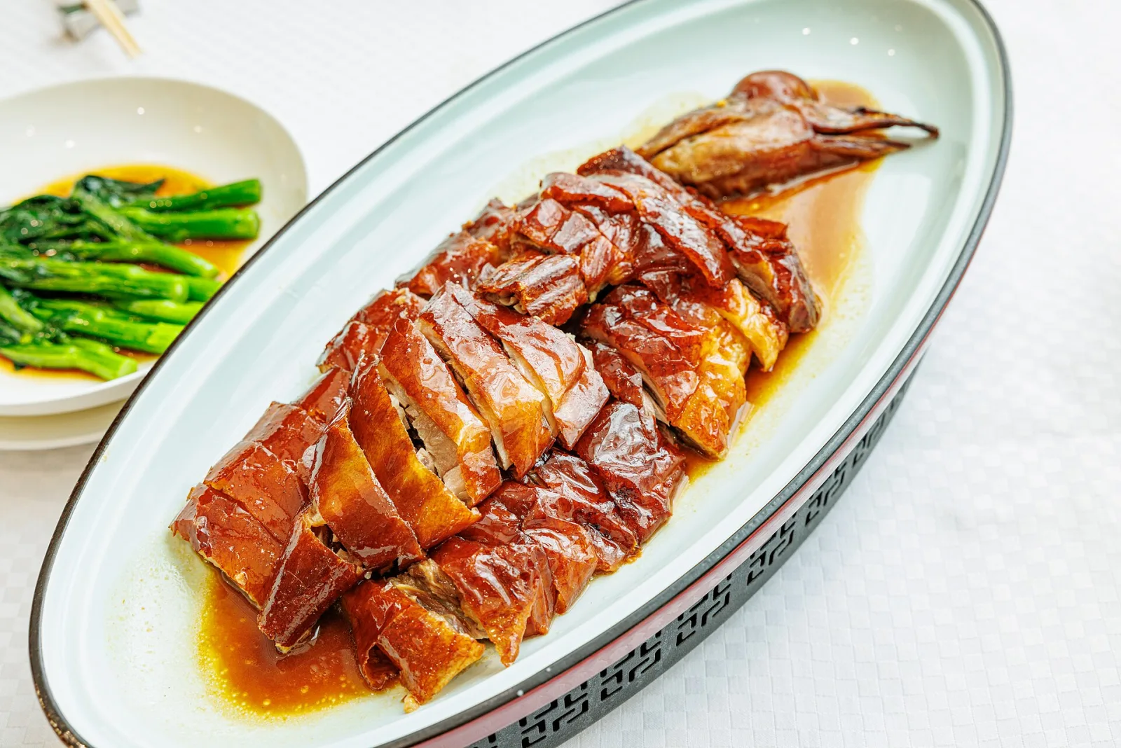 Cantonese roast goose cut into pieces on a serving plate