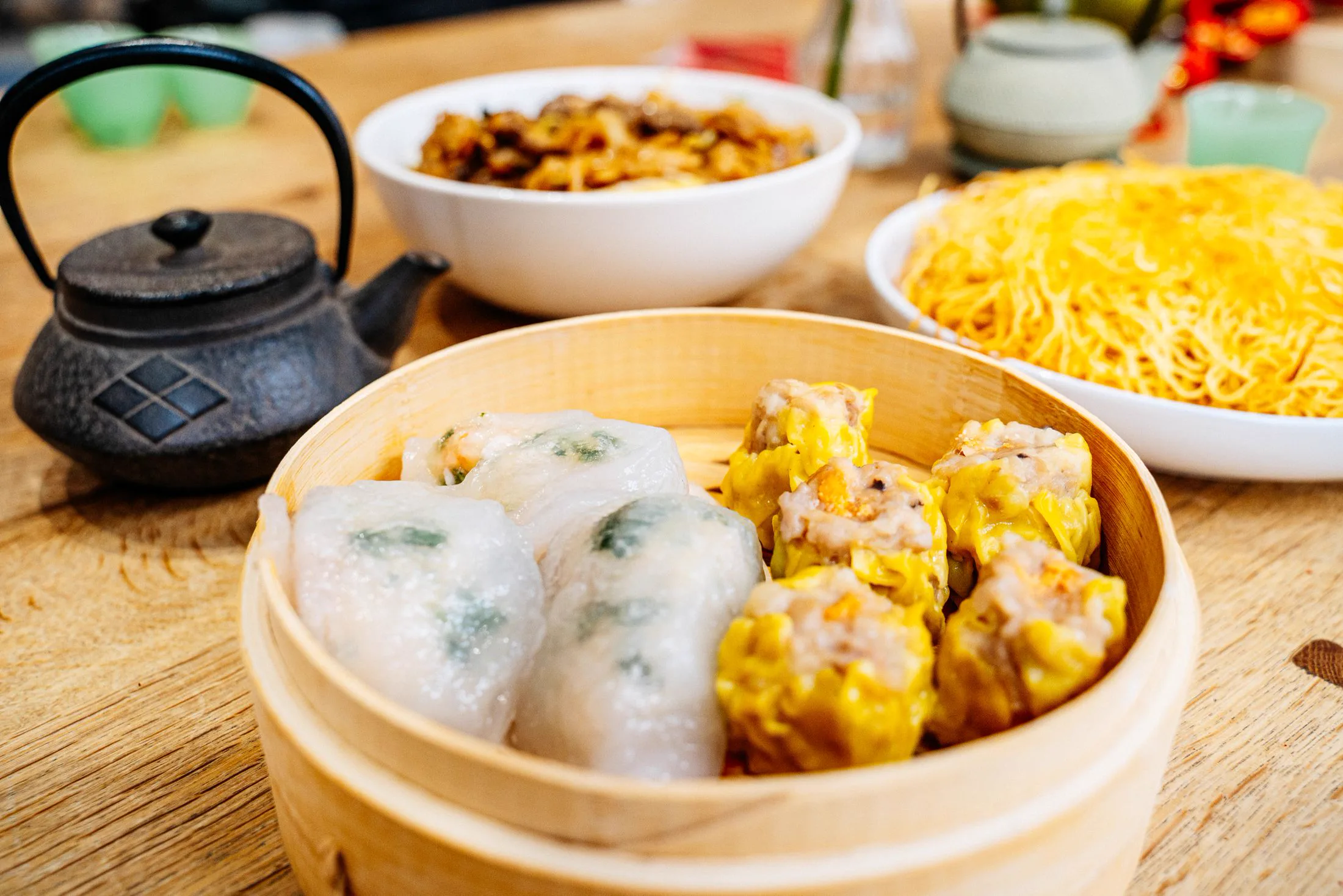 Cantonese dim sum beside a tea set
