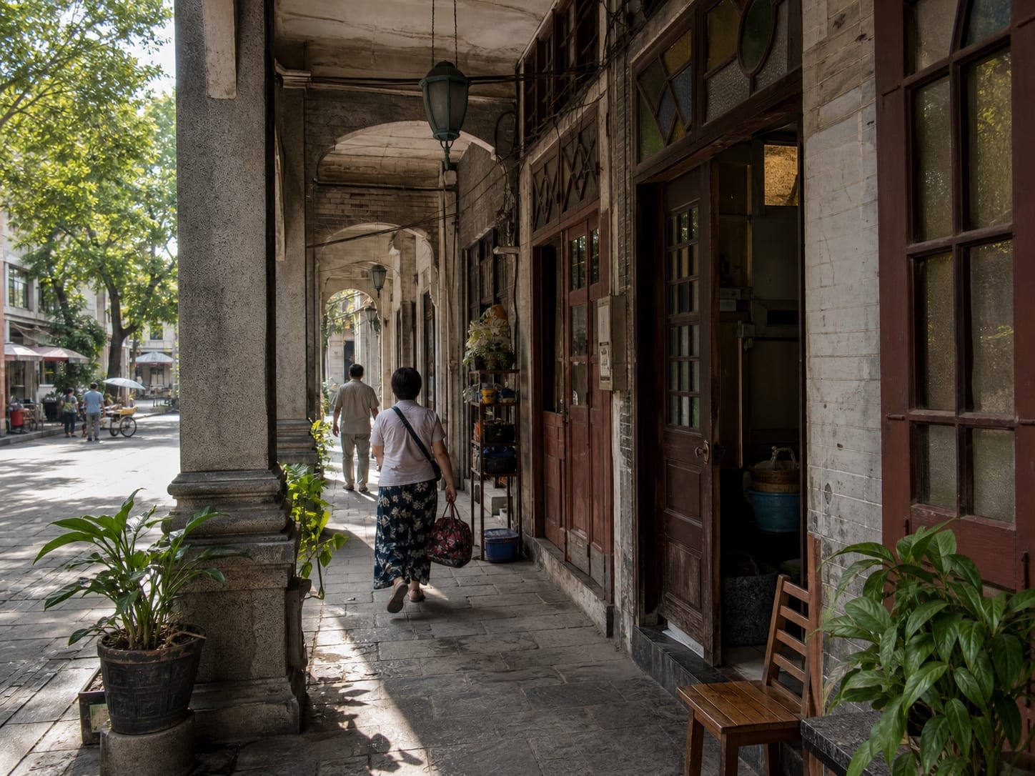 Shaded qilou arcades and daily street life on Enning Road