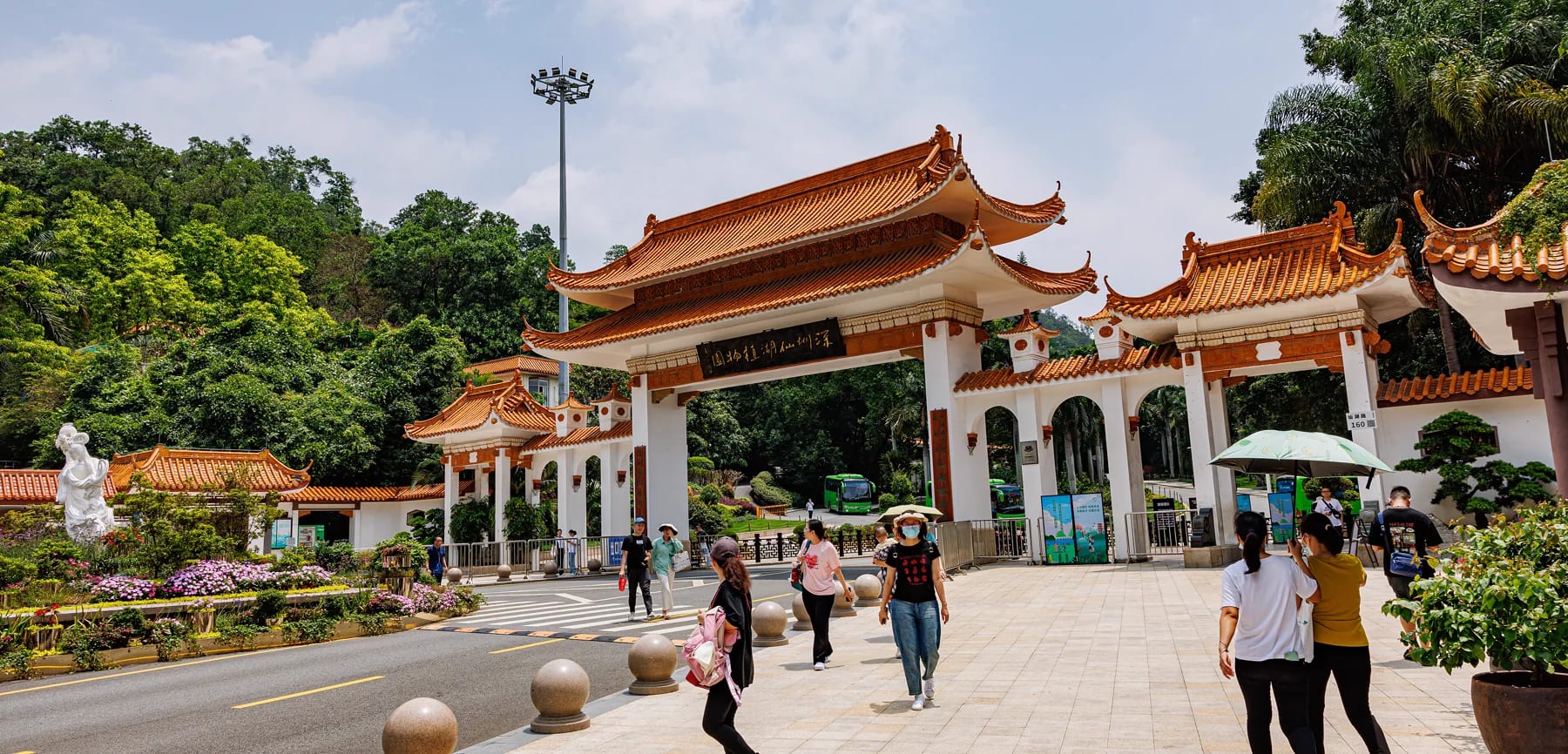 The main gate of Fairy Lake Botanical Garden framed by green hills