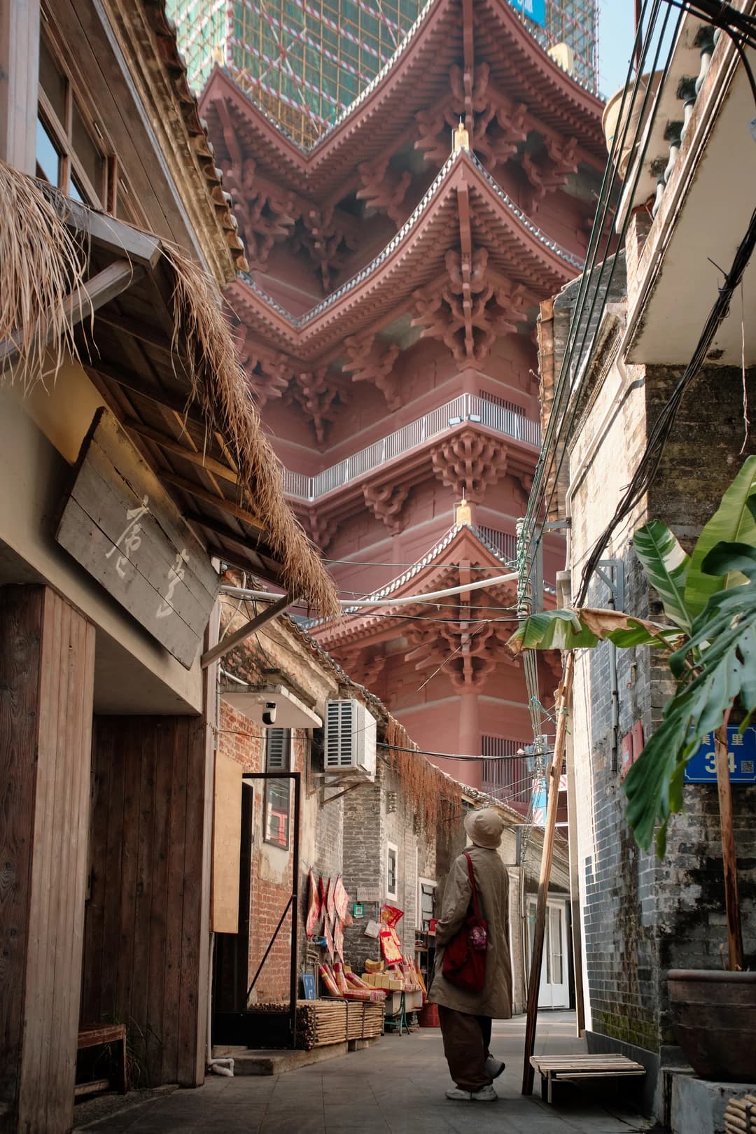 Renshou Temple pagoda rising above a narrow old lane in Foshan