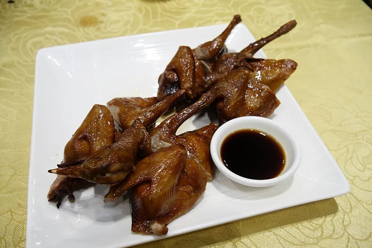 Two roast pigeons with crisp, browned skin