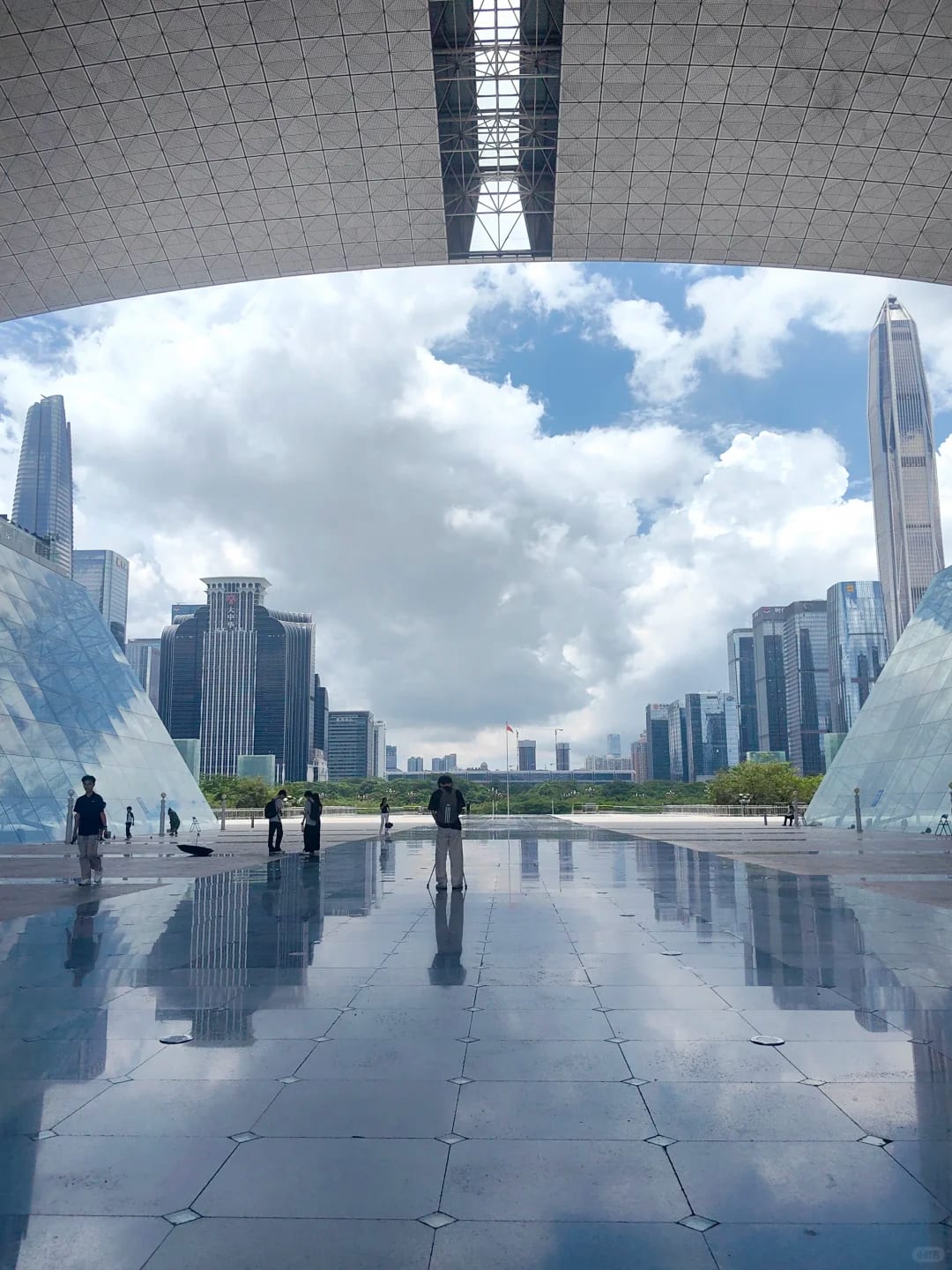 Shenzhen Civic Center and the Futian skyline framed by the plaza canopy