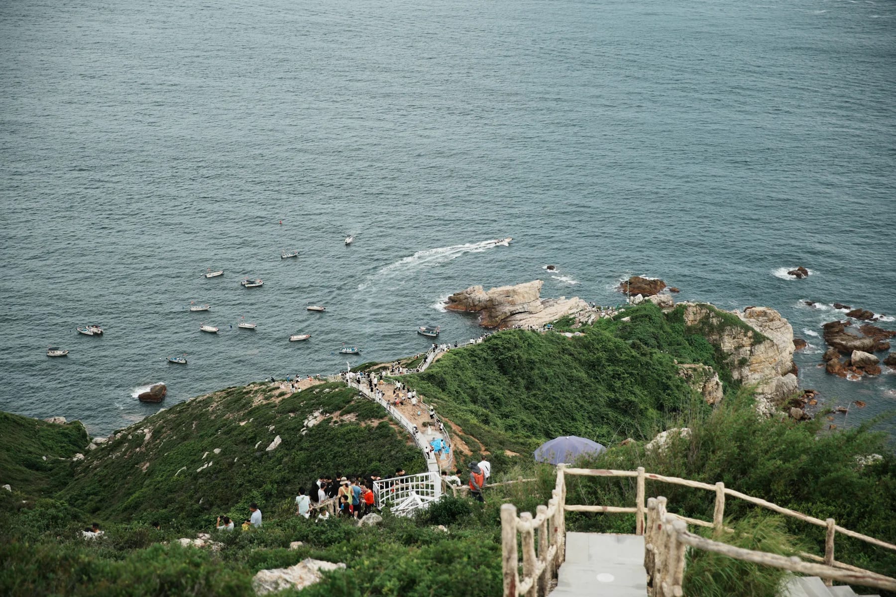 The cliffside boardwalk descending toward the Xichong coast at Shenzhen Observatory